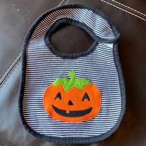 Carter’s black/white striped Halloween bib with pumpkin